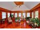 Cozy sun room with wood paneled walls and floors and several windows for natural light and views at 3889 Pineybrook Dr, Loganville, GA 30052