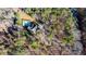 Aerial view of a home with a private pool surrounded by lush greenery at 551 Lees Mill Rd, Fayetteville, GA 30214