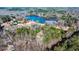 Aerial view of home and the lake, showcasing serene location surrounded by dense trees at 551 Lees Mill Rd, Fayetteville, GA 30214