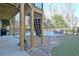 Backyard outdoor dining area with a pool view and a stone walkway at 551 Lees Mill Rd, Fayetteville, GA 30214