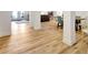 Finished basement with durable hardwood flooring, white columns, and neutral paint at 551 Lees Mill Rd, Fayetteville, GA 30214