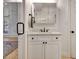 Stylish bathroom boasts a vanity, tiled shower with glass door, and modern fixtures at 551 Lees Mill Rd, Fayetteville, GA 30214