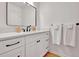 Bathroom features a white vanity with black fixtures, a mirror, and a towel bar at 551 Lees Mill Rd, Fayetteville, GA 30214