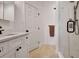 Modern bathroom featuring a white vanity, tile floor, and a walk-in shower at 551 Lees Mill Rd, Fayetteville, GA 30214