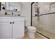 Bathroom features a white vanity, toilet, and shower with black hardware at 551 Lees Mill Rd, Fayetteville, GA 30214