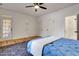 Bright bedroom with white walls, an exterior door, and ceiling fan at 551 Lees Mill Rd, Fayetteville, GA 30214
