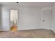 Bedroom featuring neutral walls and carpet, with a view to an adjacent bathroom at 551 Lees Mill Rd, Fayetteville, GA 30214