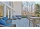 A spacious outdoor deck with ample seating and a table, perfect for relaxing or entertaining guests at 551 Lees Mill Rd, Fayetteville, GA 30214