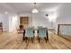 The dining room has hardwood floors and ample light creating an inviting space at 551 Lees Mill Rd, Fayetteville, GA 30214