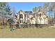 Stately two-story home featuring a manicured lawn and symmetrical design at 551 Lees Mill Rd, Fayetteville, GA 30214