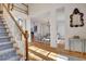 Bright foyer with hardwood floors, staircase, and elegant design at 551 Lees Mill Rd, Fayetteville, GA 30214