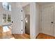 Bright foyer with hardwood flooring, white doors and beautiful natural light at 551 Lees Mill Rd, Fayetteville, GA 30214