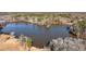 Scenic view of lake, highlighting the tranquil location and nearby homes at 551 Lees Mill Rd, Fayetteville, GA 30214
