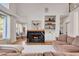 Spacious living room showcasing a fireplace and elegant furnishings at 551 Lees Mill Rd, Fayetteville, GA 30214