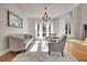 Well-lit living room featuring a large window and comfortable seating at 551 Lees Mill Rd, Fayetteville, GA 30214