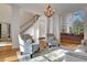 Sunlit living room with hardwood floors and an open concept design at 551 Lees Mill Rd, Fayetteville, GA 30214