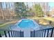 In-ground pool and patio area perfect for outdoor enjoyment and relaxation in a private backyard setting at 551 Lees Mill Rd, Fayetteville, GA 30214