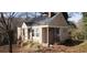 Traditional single-Gathering home with covered porch and mature trees at 1497 Clermont Ct, Atlanta, GA 30344