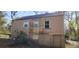 Rear view of the house, showing the second story and partial basement access at 1497 Clermont Ct, Atlanta, GA 30344