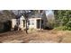 A quaint single-Gathering home with a traditional design, surrounded by trees at 1497 Clermont Ct, Atlanta, GA 30344