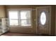 Bright living room with natural light, built-in shelving, and an inviting front door at 1497 Clermont Ct, Atlanta, GA 30344