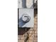 Close-up of a utility meter box mounted on a brick wall, showing its components and placement at 1497 Clermont Ct, Atlanta, GA 30344