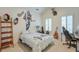 Charming bedroom complete with wall decor, desk, and natural light from the bright windows, an inviting space at 2144 Whitekirk Nw St, Kennesaw, GA 30152