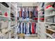 Well-organized walk-in closet with shelves, hanging rods, drawers and storage baskets in this closet at 2144 Whitekirk Nw St, Kennesaw, GA 30152