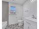 Modern bathroom with gray-tile accents, stylish flooring, vanity, toilet, and shower at 2250 Deer Oaks Trl, Lawrenceville, GA 30044