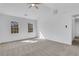 Bright bedroom with plush carpeting, white walls and ceiling fan, as well as lots of natural light at 2250 Deer Oaks Trl, Lawrenceville, GA 30044