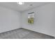 Bright bedroom featuring neutral walls, carpet, and a window letting in natural light at 2250 Deer Oaks Trl, Lawrenceville, GA 30044