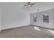 Spacious bedroom features plush carpet, ceiling fan and two windows that allow ample natural light at 2250 Deer Oaks Trl, Lawrenceville, GA 30044