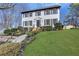 Charming two-story home with landscaped front yard, freshly painted white brick and black shutters at 2250 Deer Oaks Trl, Lawrenceville, GA 30044