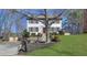 Charming two-story home with a well-manicured lawn, brick accents, and mature trees at 2250 Deer Oaks Trl, Lawrenceville, GA 30044