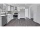 Bright kitchen featuring stainless steel appliances, white cabinets and granite counters at 2250 Deer Oaks Trl, Lawrenceville, GA 30044