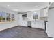 Eat-in kitchen with white cabinets, stainless steel appliances and three large windows for natural light at 2250 Deer Oaks Trl, Lawrenceville, GA 30044
