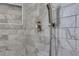 Shower featuring marble tile surround and handheld sprayer at 2250 Deer Oaks Trl, Lawrenceville, GA 30044