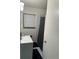 Bathroom area featuring a single sink, a window, and a shower with a curtain at 3042 Santa Monica Dr, Decatur, GA 30032