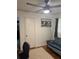 Cozy bedroom with a ceiling fan, vintage art, and an accent chair at 3042 Santa Monica Dr, Decatur, GA 30032