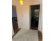 Hallway with doorways, a neutral carpet, and hardwood flooring at 3042 Santa Monica Dr, Decatur, GA 30032