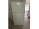 Clean white refrigerator with top and bottom compartments and a modern design at 3042 Santa Monica Dr, Decatur, GA 30032