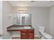 Bathroom with a single sink vanity, providing a functional and tidy space with storage at 6462 Splitpine Ct, Atlanta, GA 30349