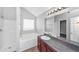 Bathroom featuring a vanity, tub, shower, and white walls at 6462 Splitpine Ct, Atlanta, GA 30349