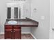 Bathroom featuring a vanity with granite countertop, a mirror, and a sink at 6462 Splitpine Ct, Atlanta, GA 30349