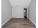 Bedroom with hardwood floors and access to other rooms in the home at 6462 Splitpine Ct, Atlanta, GA 30349