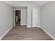 Neutral-toned bedroom with hardwood flooring and plenty of natural light at 6462 Splitpine Ct, Atlanta, GA 30349