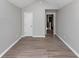 Neutral-toned bedroom with hardwood flooring and plenty of natural light at 6462 Splitpine Ct, Atlanta, GA 30349