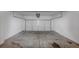 A standard two car garage with automatic door and concrete flooring at 6462 Splitpine Ct, Atlanta, GA 30349