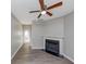 Comfortable living room with hardwood floors, a fireplace, and bright windows at 6462 Splitpine Ct, Atlanta, GA 30349
