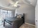 Comfortable bedroom with ceiling fan, carpeted floors, and natural light from the window at 5809 Savannah River, Atlanta, GA 30349